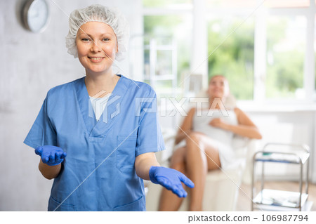 Adult female doctor posing in medical room Adult female doctor posing in medical room 106987794