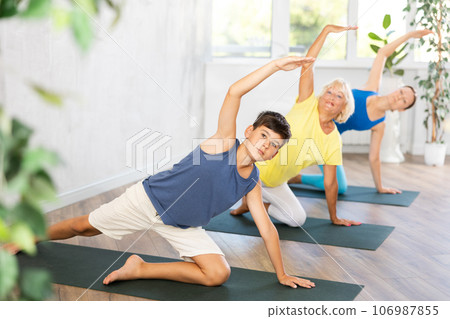 Family of three people practice yoga Family of three people practice yoga 106987855