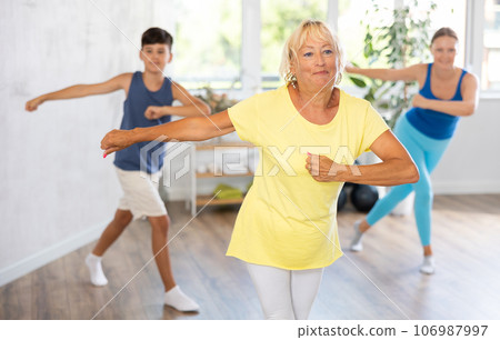 Group of people in gym incendiary dance doing fitness Group of people in gym incendiary dance doing fitness 106987997