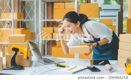 Small business owners Online Retailers rejoice and be happy with orders coming in from online customers.concept shopping online Small business owners Online Retailers rejoice and be happy with orders coming in from online customers.concept shopping online 106988258
