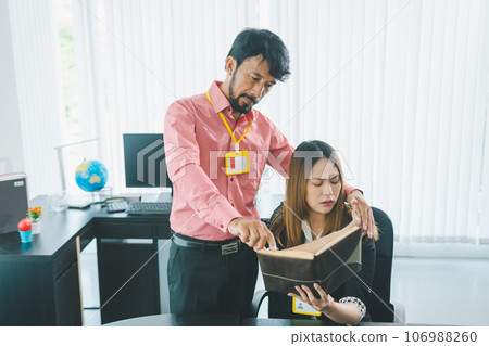 Boss or supervisor touching female employee's shoulder Causing young employees to resist because they are uncomfortable and afraid of being sexually abused. Concept of sexual harassment in the 106988260