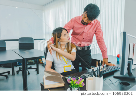 Boss or supervisor touching female employee's shoulder Causing young employees to resist because they are uncomfortable and afraid of being sexually abused. Concept of sexual harassment in the 106988301