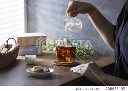 Coffee drinking by the cafe window 106988405