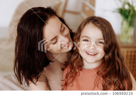 Portrait of smiling mother and daughter Portrait of smiling mother and daughter 106989210