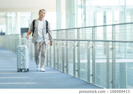 Senior man traveling Senior man traveling 106989413