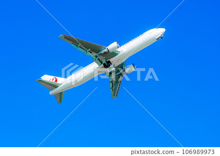 Airplane taking off with blue sky 106989973