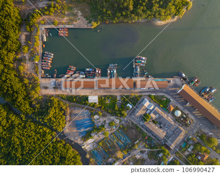 High angle view fisherman boats at the jetty located in Phuket Thailand, aerial view drone top down view,Siray fishing port Phuket Thailand 106990427
