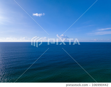 Waves sea water surface nature background,Sun rays over sea, Bird's eye view ocean in sunny day,Sea ocean waves water background 106990442