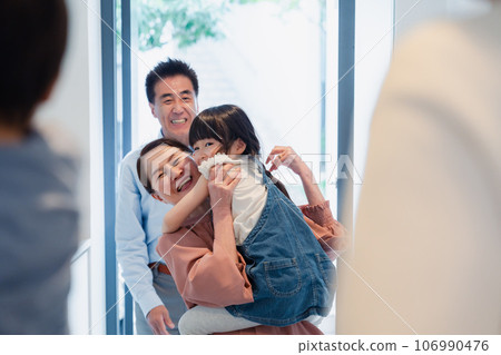 Grandparents visiting their grandchildren's homes Grandparents visiting their grandchildren's homes 106990476