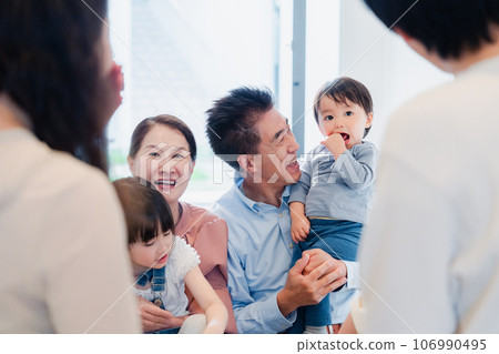 Grandparents visiting their grandchildren's homes Grandparents visiting their grandchildren's homes 106990495