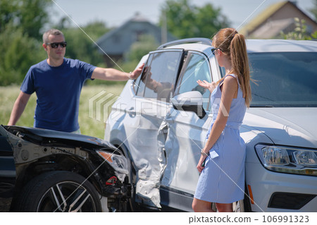 Two drivers having argument over who is guilty in car crash accident. Road safety and insurance concept 106991323