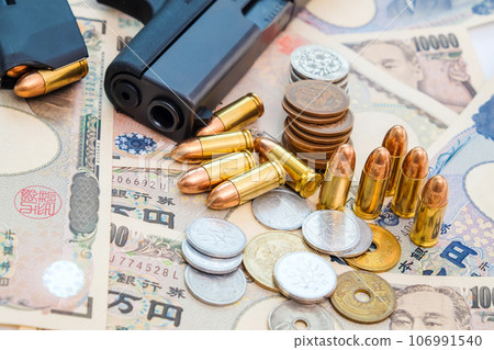 Japanese money bill coin with gun and bullet Japanese money bill coin with gun and bullet 106991540