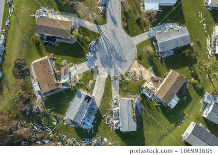 Property damage from strong hurricane winds. Mobile homes in Florida residential area with destroyed rooftops. Consequences of natural disaster Property damage from strong hurricane winds. Mobile homes in Florida residential area with destroyed rooftops. Consequences of natural disaster 106991685