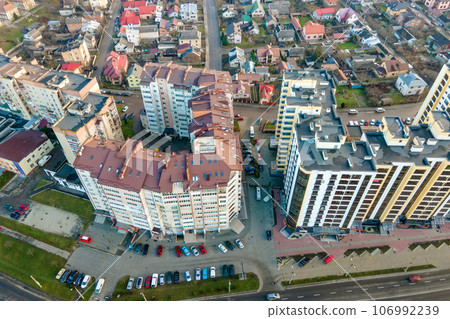 High rise apartment buildings and streets with traffic in city residential area. 106992239