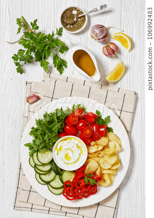 Potato Chips, leafy greens, veggies snack platter 106992483