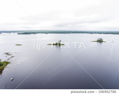 river and islands in morning mist at Kejimkujik National Park Designated Canoe ride Wilderness Nova Scotia Canada 106992786