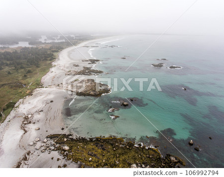 Exploring the beach in the mist morning at Kejimkujik National Park Seaside, Nova Scotia, Canada 106992794