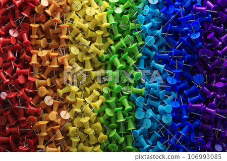 several assorted colors of plastic push pins 106993085