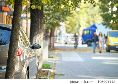 Close up of a car parked illegally against traffic rules on pedestrian city street side Close up of a car parked illegally against traffic rules on pedestrian city street side 106993558