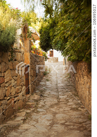 Old Datca streets with its unique architecture and people walking around, Mugla Datca Turkey, June 29 2023 106995017