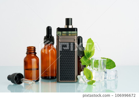 Vape liquid with mint flavour on white background Vape liquid with mint flavour on white background 106996672