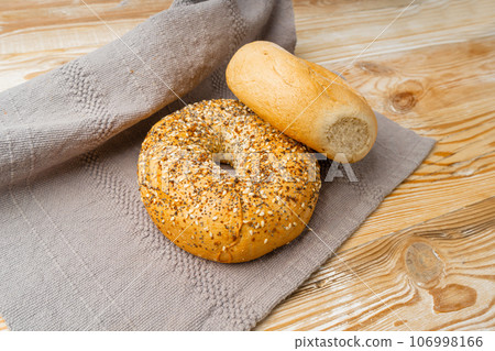 Bagel, Round Bread Bun, Wheat Bakery with Grains And Seeds for Breakfast, Plain Circle Bagel Bread 106998166