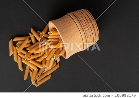 Raw Brown Pasta, Wholegrain Penne, Dry Whole Grain Noodle, Raw Spelt Macaroni, Healthy Italy Food 106998179