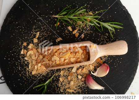 Dry Garlic Slices, Crispy Fried Cloves Pile Closeup, Roasted Grilled Garlic Flakes, Clove Chip Group Dry Garlic Slices, Crispy Fried Cloves Pile Closeup, Roasted Grilled Garlic Flakes, Clove Chip Group 106998217