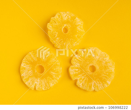Dry Pineapple Rings Isolated, Candy Pineapples, Dehydrated Yellow Sugar Fruit, Candied Fruits Circles 106998222