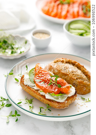 Salmon salted sandwich with spinach and cream cheese 106998522