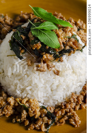 Minced pork with basil over rice is a Thai food that is popular among Thai people Minced pork with basil over rice is a Thai food that is popular among Thai people 106999014