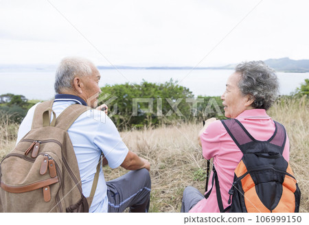 Happy Senior couple hiking on the mountains 106999150