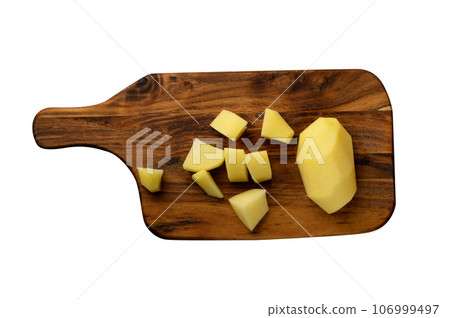 Raw Chopped Potato on Wooden Cutting Board Background 106999497
