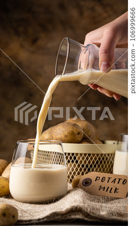 Potato milk alternative non dairy drink in glass Potato milk alternative non dairy drink in glass 106999666