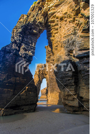 beautiful beach with blue sea and rocks beautiful beach with blue sea and rocks 107001329