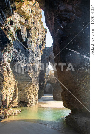 beautiful beach with blue sea and rocks beautiful beach with blue sea and rocks 107001334