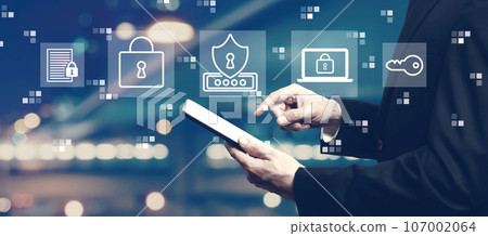 Cyber security theme with businessman using a tablet Cyber security theme with businessman using a tablet 107002064