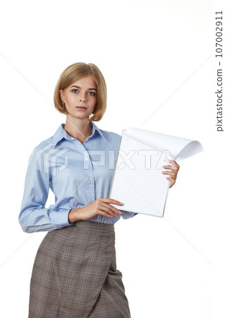 businesswoman in formal wear with clipboard in office 107002911