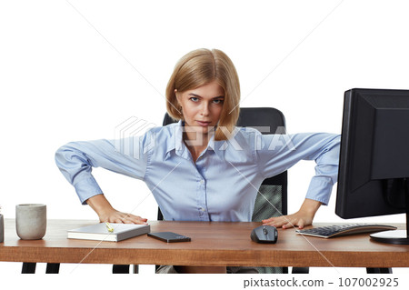 angry business woman looking at camera and using computer angry business woman looking at camera and using computer 107002925