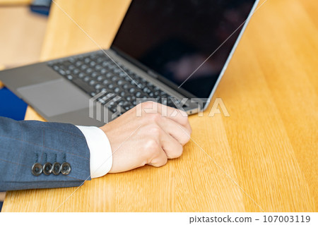 Business men and women, computers at hand Business men and women, computers at hand 107003119