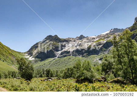 Mountain slopes with dense green vegetation 107003192