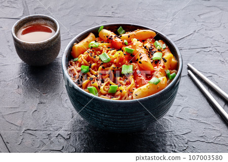 Rabokki, tteokbokki or topokki with ramen, Korean street food, spicy rice cakes 107003580