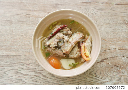 hot and spicy pork bone with tamarind and Thai herbs soup on bowl hot and spicy pork bone with tamarind and Thai herbs soup on bowl 107003672