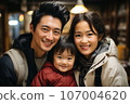 Portrait of Asian family parents and girl in cafe 107004620