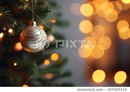 Christmas tree branch over bokeh background. Copy space. Generative AI content 107005410