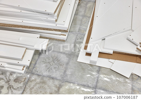 stack of white MDF panels lie on floor stack of white MDF panels lie on floor 107006187