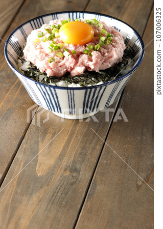 Single photo of a bowl of shredded seaweed, egg yolk, and green onion toro Single photo of a bowl of shredded seaweed, egg yolk, and green onion toro 107006325
