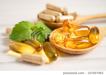 Alternative medicine herbal organic capsule with vitamin E omega 3 fish oil, mineral, drug with herbs leaf natural supplements for healthy good life. 107007965
