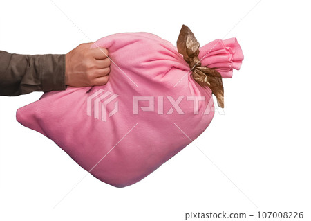 The man is holding a pink soft bag with New Year's gifts or toys on a white background, isolated The man is holding a pink soft bag with New Year's gifts or toys on a white background, isolated 107008226