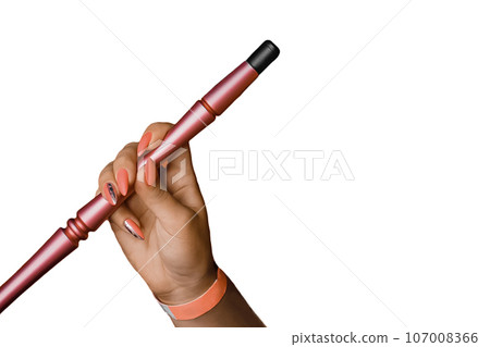 The hand of a young girl with a manicure holds a smoking object, a hookah pipe, on a white background isolated The hand of a young girl with a manicure holds a smoking object, a hookah pipe, on a white background isolated 107008366